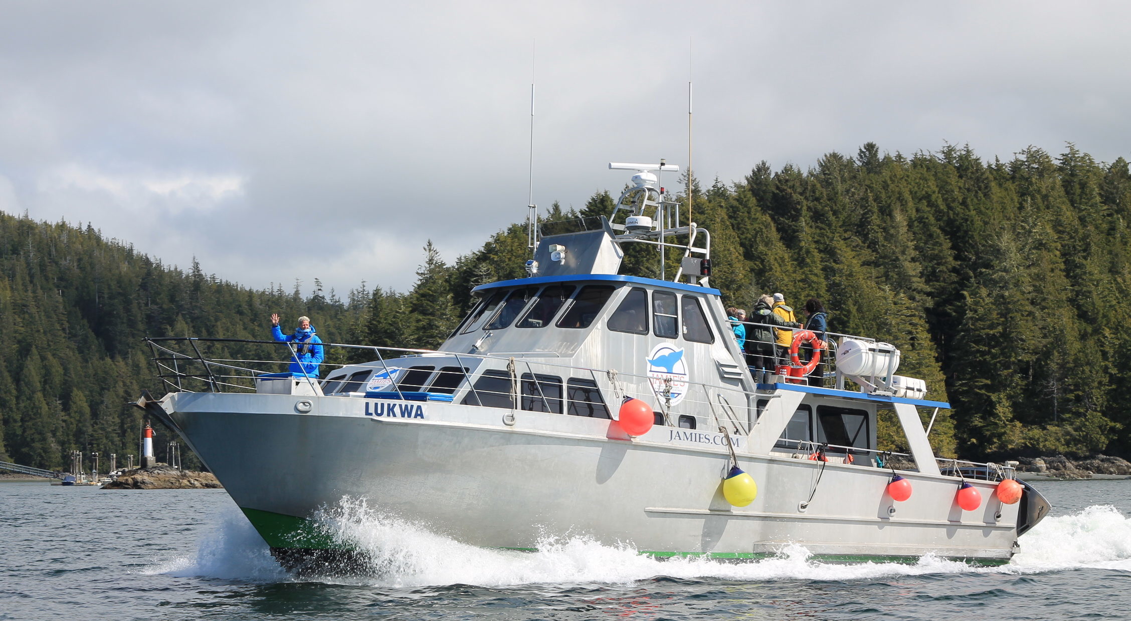 a man driving a boat in the water
