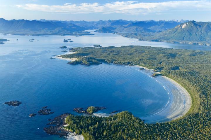 a body of water with a mountain in the background