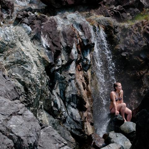 a man standing in a rocky area