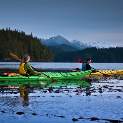 a group of people riding skis on a body of water