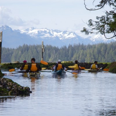a group of people on a boat in the water