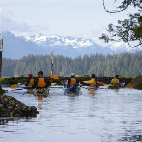 a group of people on a boat in the water