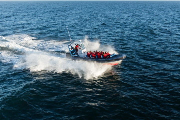 a man riding a wave on top of a body of water