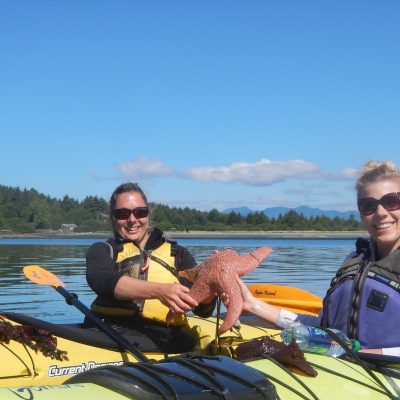 a group of people on a boat in the water