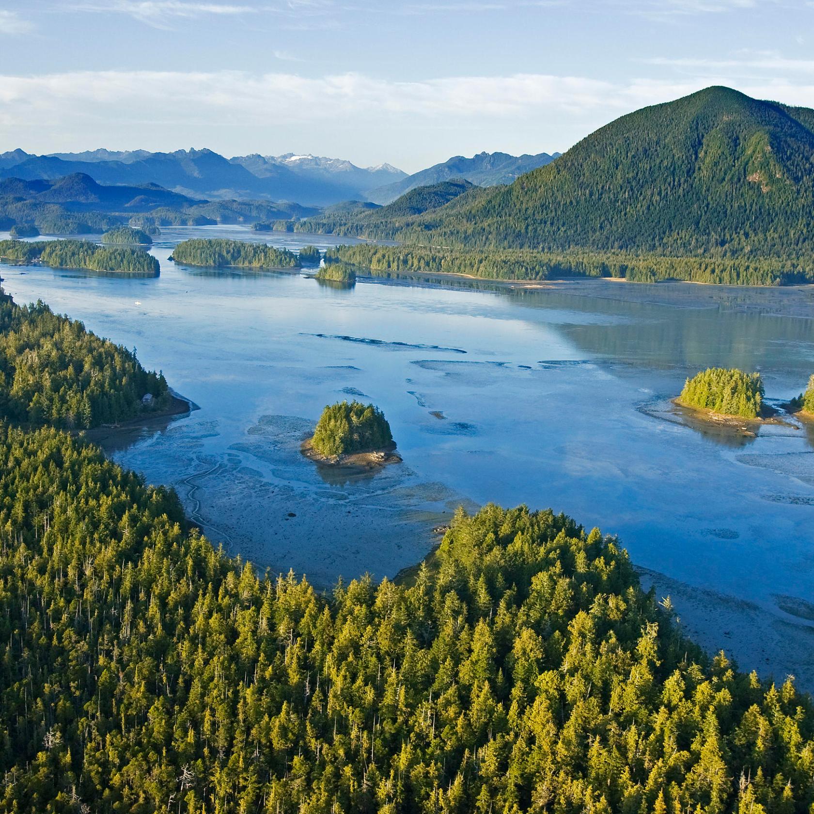 a body of water with a mountain in the background