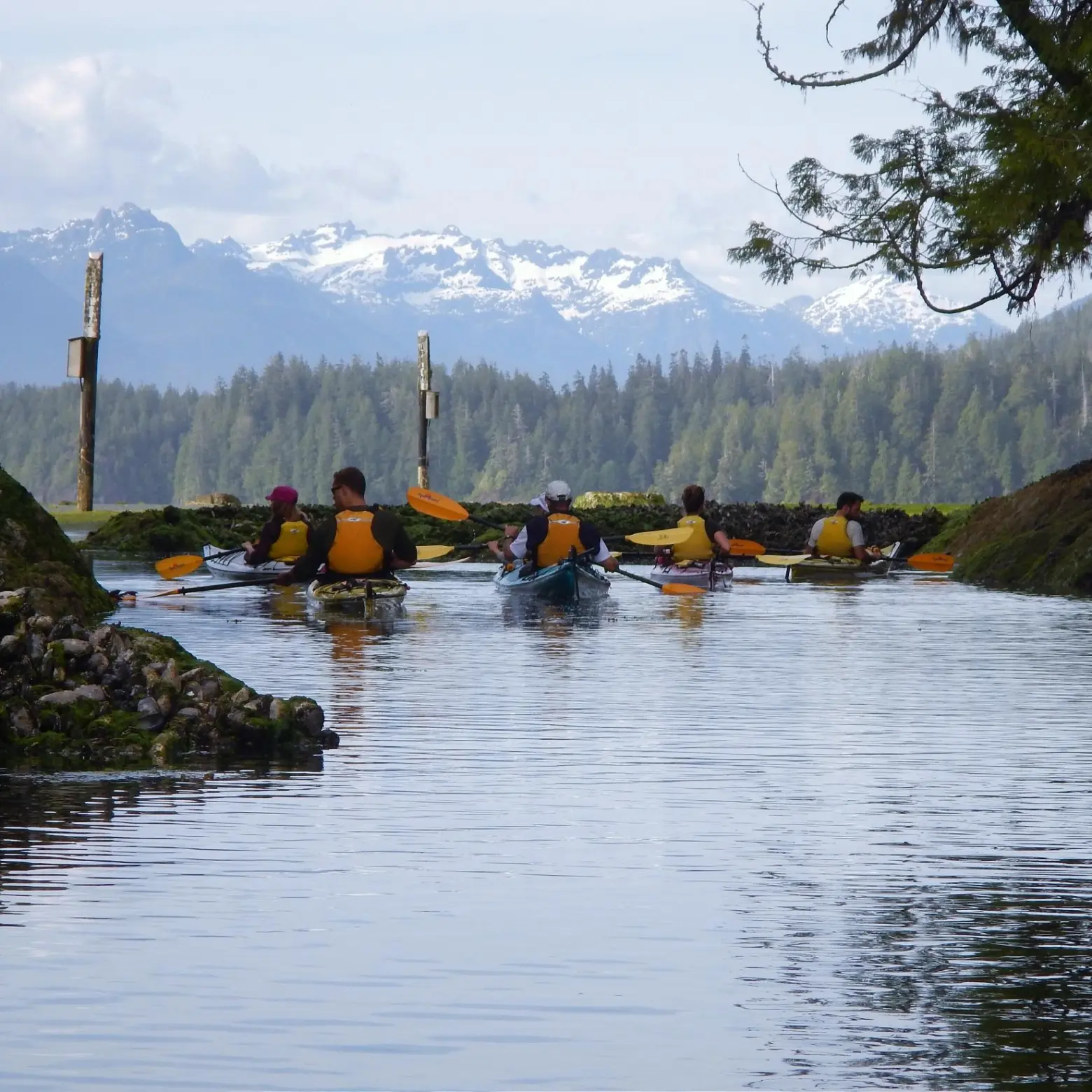 a group of people on a boat in the water