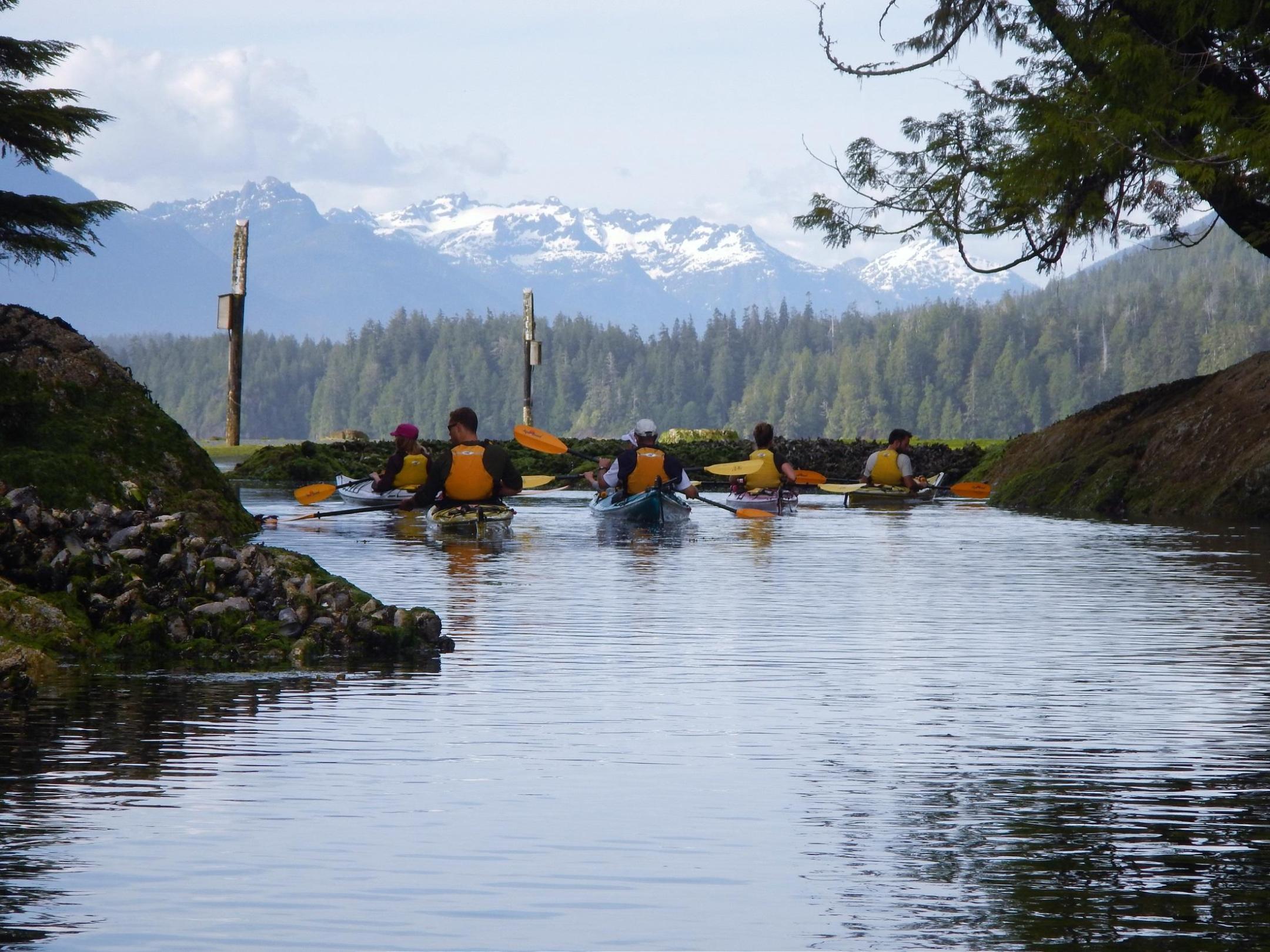 a group of people on a boat in the water