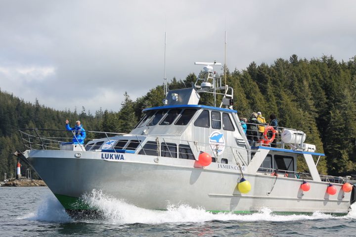 a man driving a boat in the water