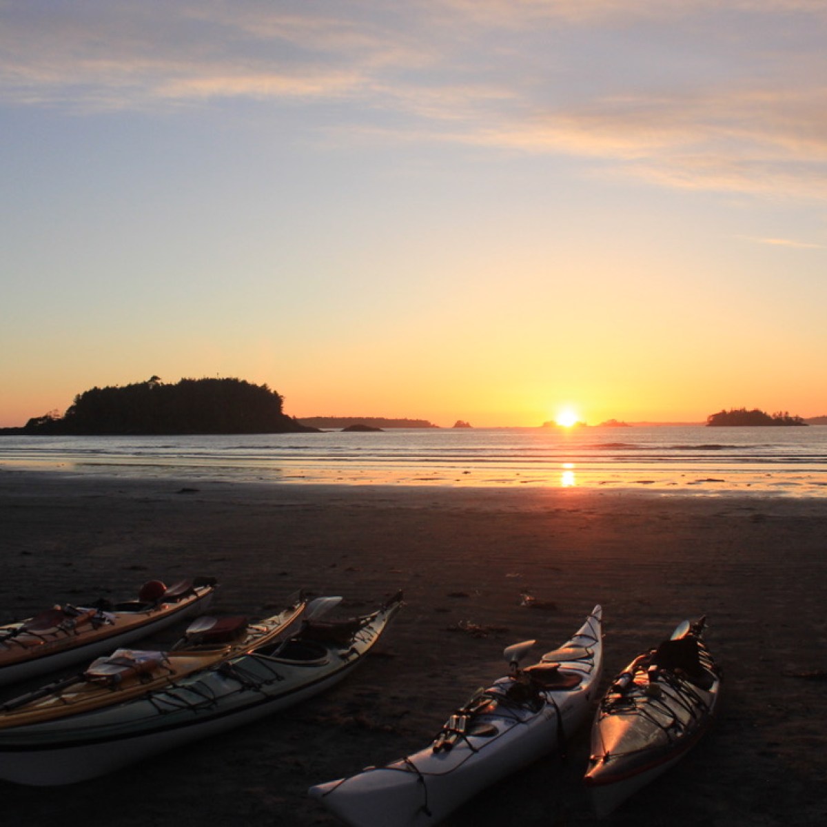 a boat on a beach near a body of water