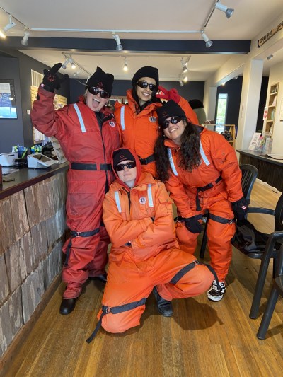 Staff Zod Suit Up a group of people posing for the camera